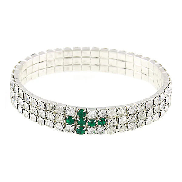 Bracelet with clear stones and a green gemstone on a white background