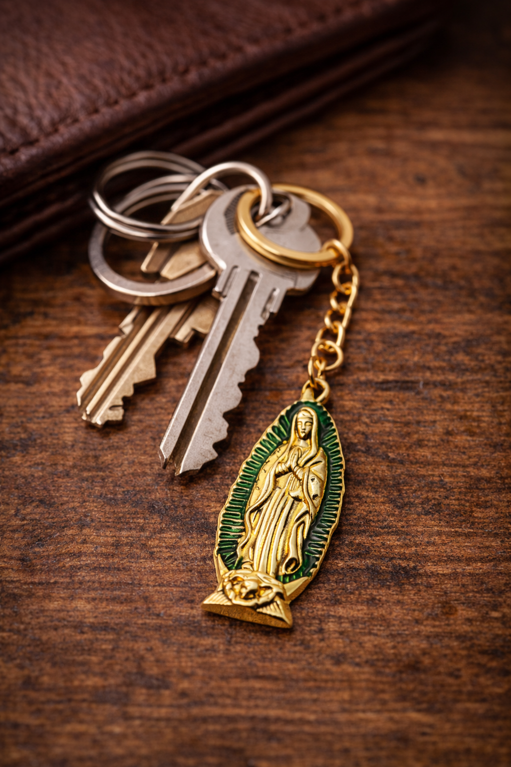 Keychain with religious pendant on a wooden surface