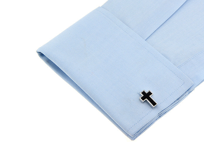 Christian cross cufflinks displayed on dress shirt cuff