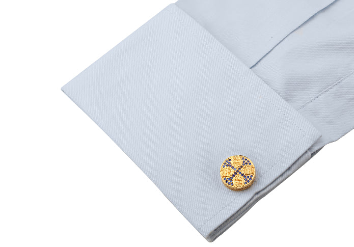 Men’s cross cufflinks displayed on dress shirt cuffs