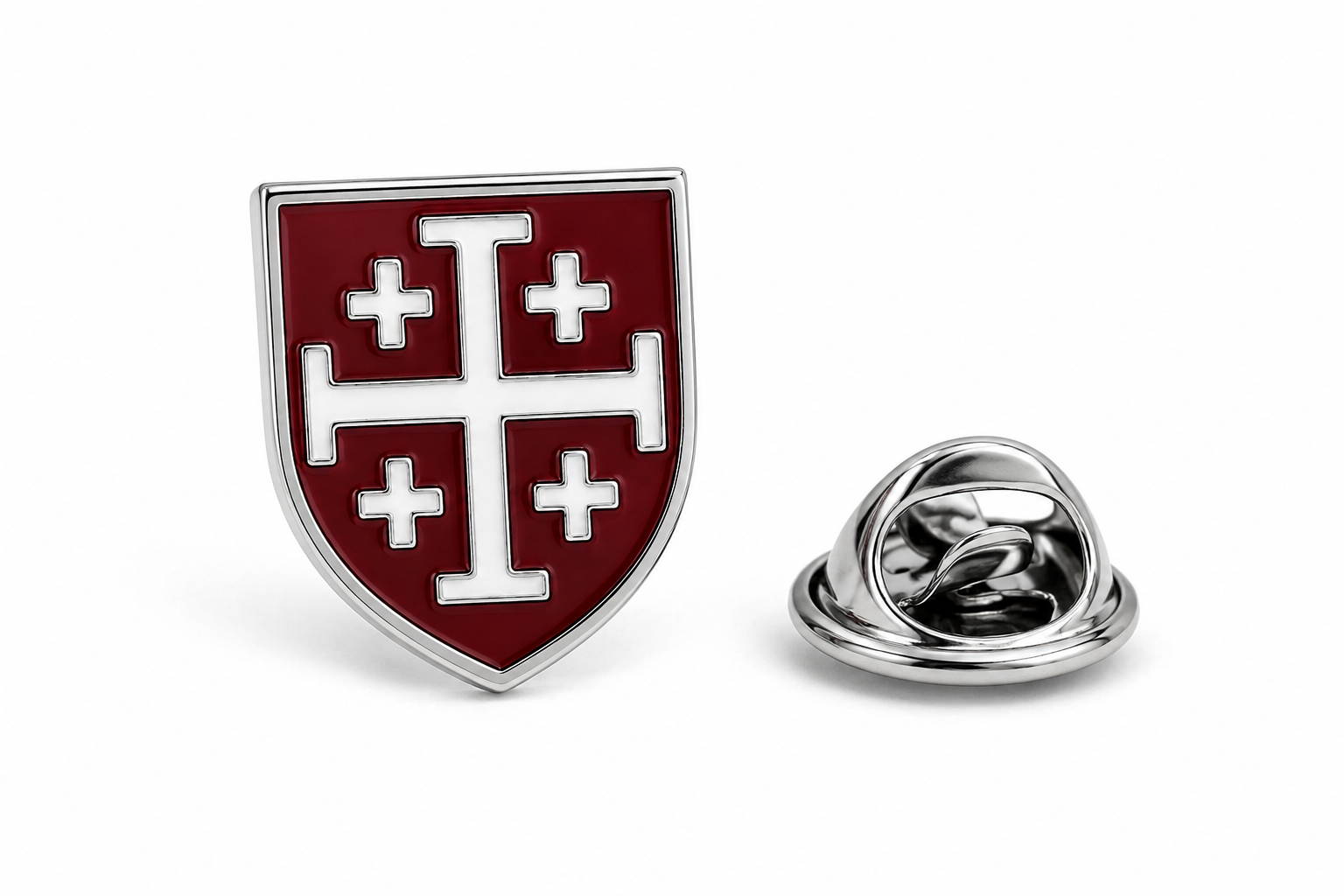 A shield-shaped enamel lapel pin with a silver-tone border and backing, featuring a dark red field with a white cross and four smaller crosses, shown alongside the metal pin clasp on a white background.