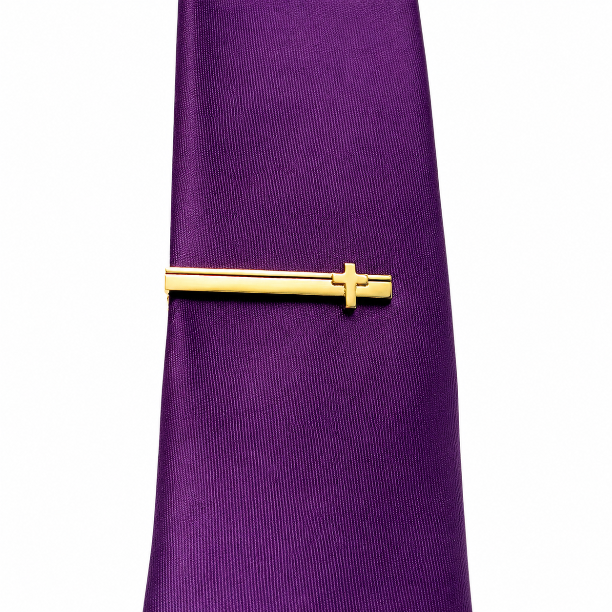 Purple tie with a gold Cross tie clip on a white background