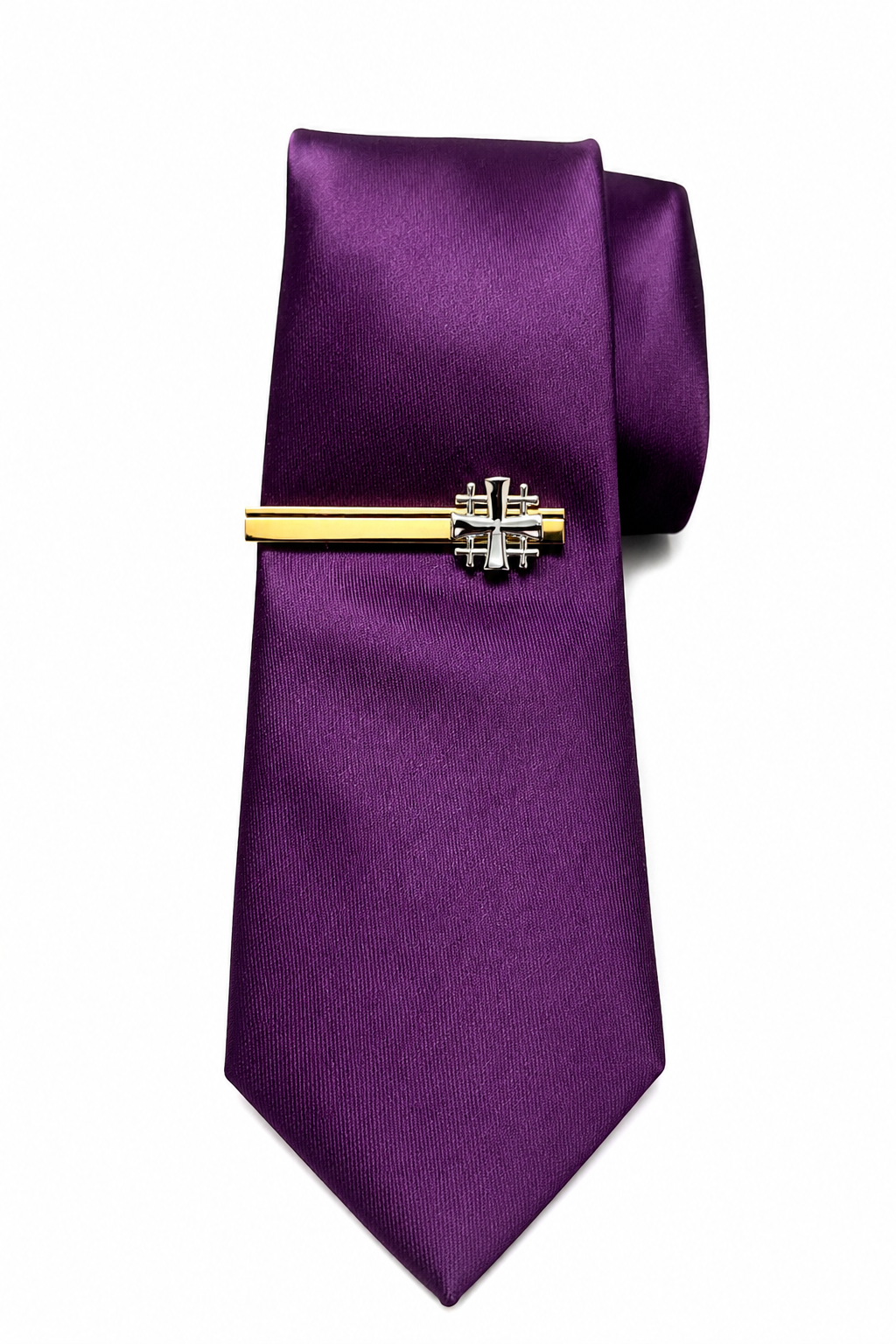 Purple tie with a gold and silver tie clip on a white background
