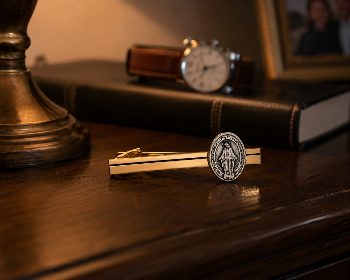 Gold Miraculous Medal tie clip with polished gold tie bar and silver-tone Catholic medal for men.