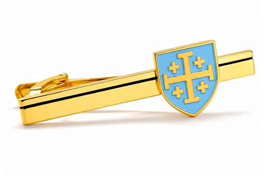 Gold tie clip featuring a light blue enamel Jerusalem Cross shield on a pure white background.