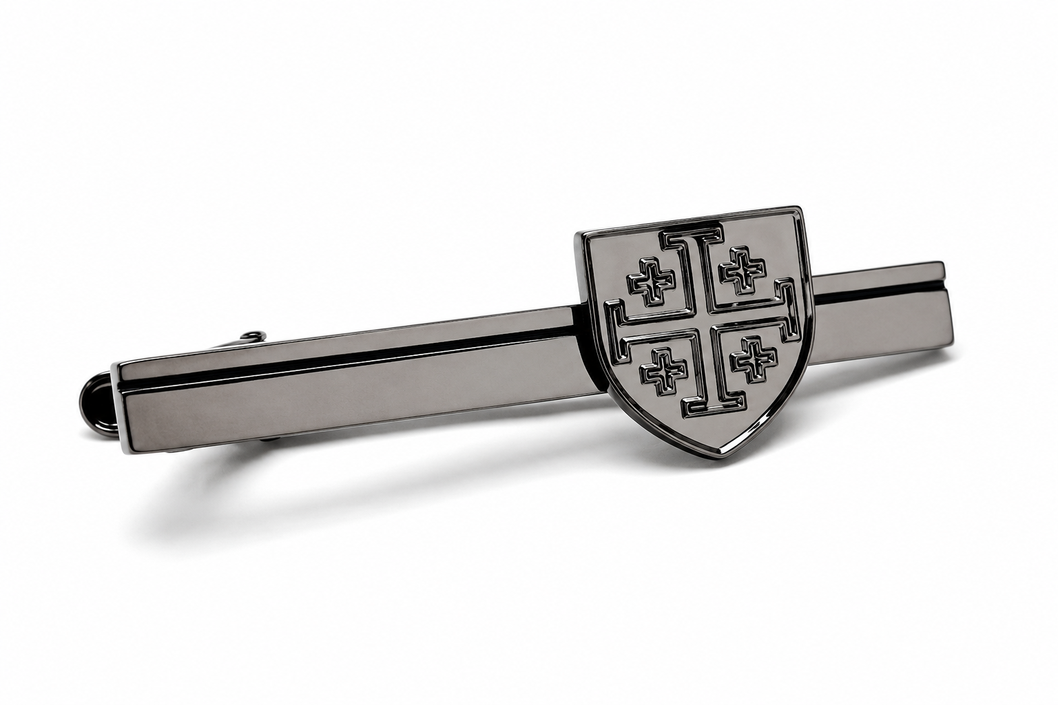 A polished silver-tone metal tie clip featuring a shield crest with four cross motifs, displayed on a clean white background.