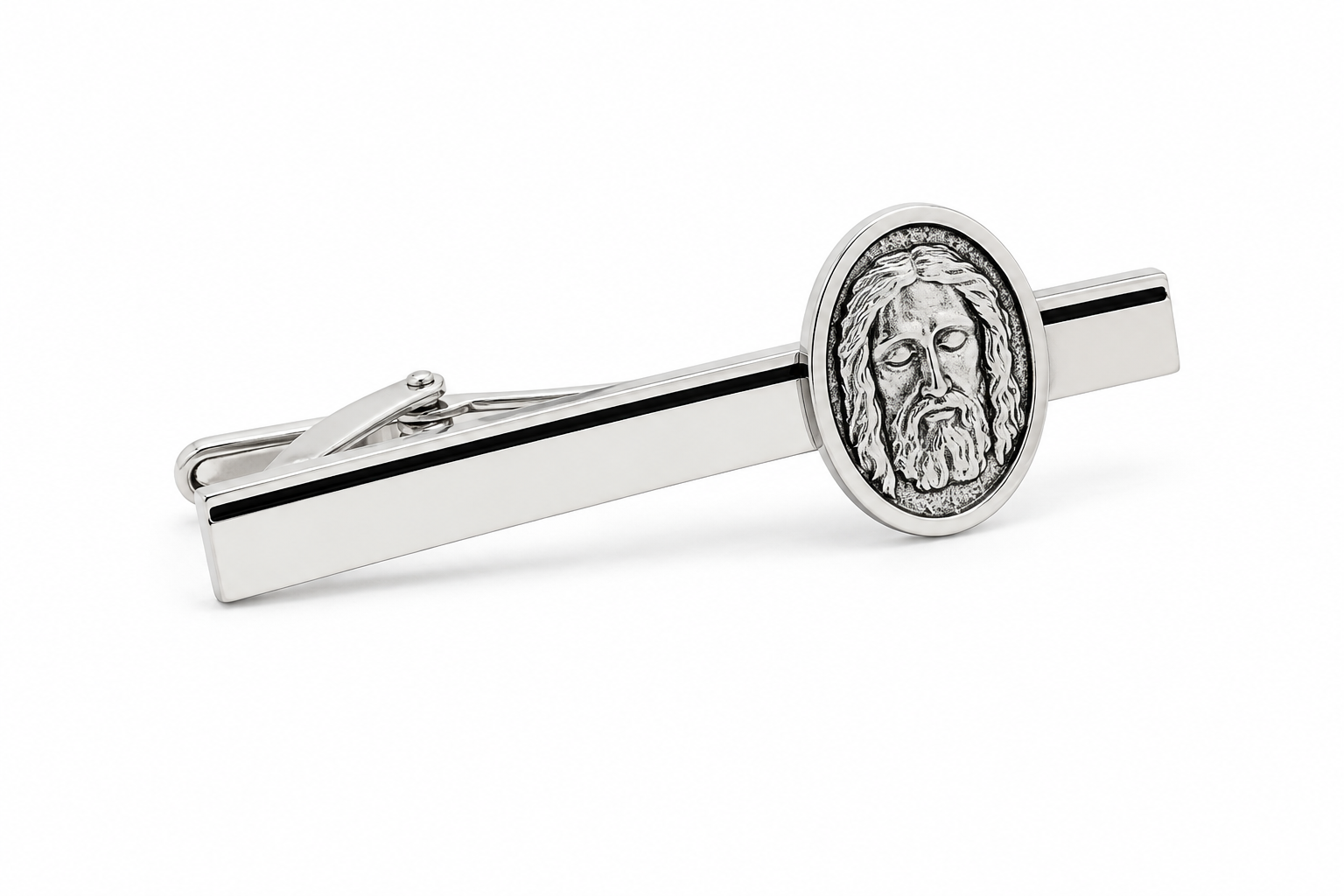 Silver tie clip with a Jesus face design on a white background