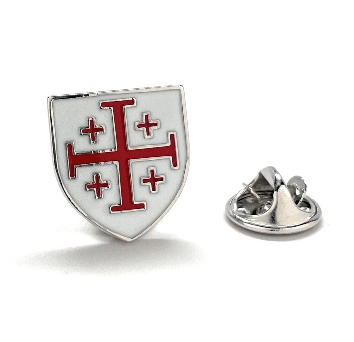 A red and white enamel pin in the shape of a shield with a cross emblem in the center, accompanied by a rhodium-plated silver butterfly back.