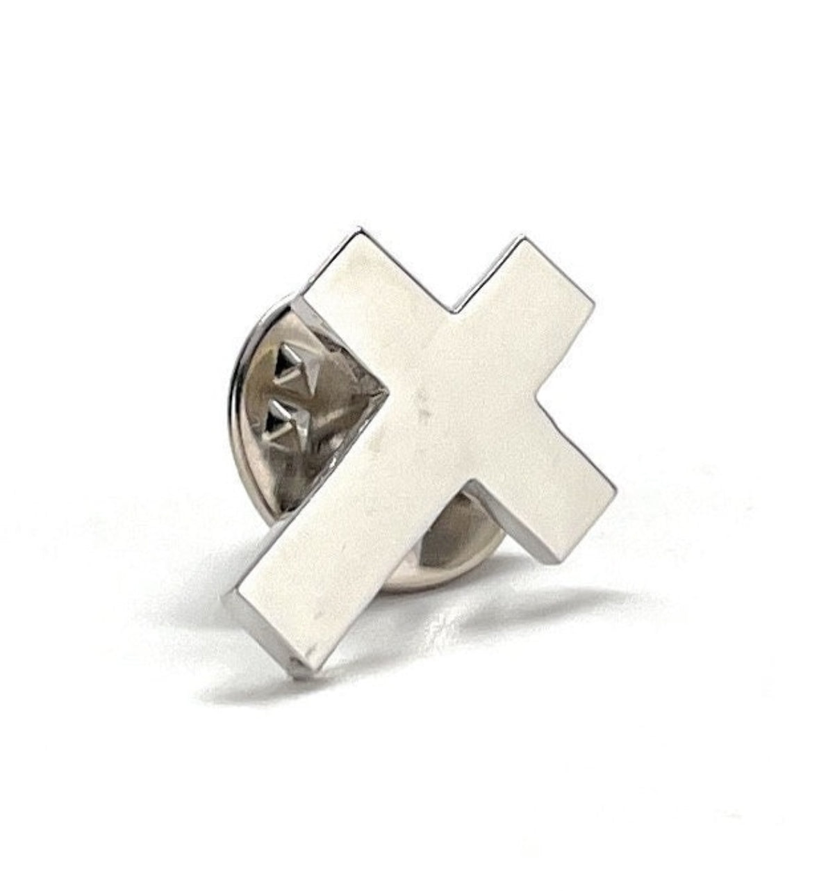 A silver-colored Christian cross lapel pin with a butterfly back, displayed against a white background.