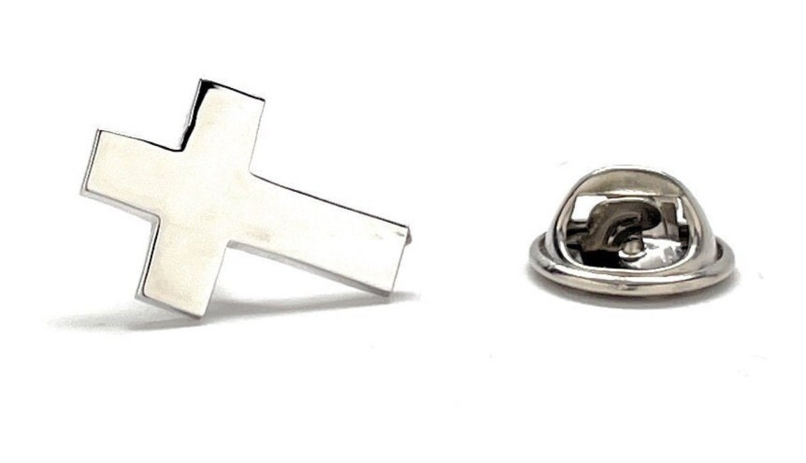 A silver-colored Christian cross lapel pin with a butterfly back, displayed against a white background.