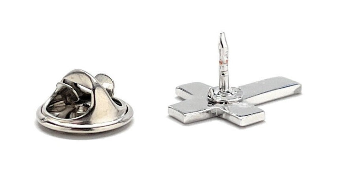 A silver-colored Christian cross lapel pin with a butterfly back, displayed against a white background.