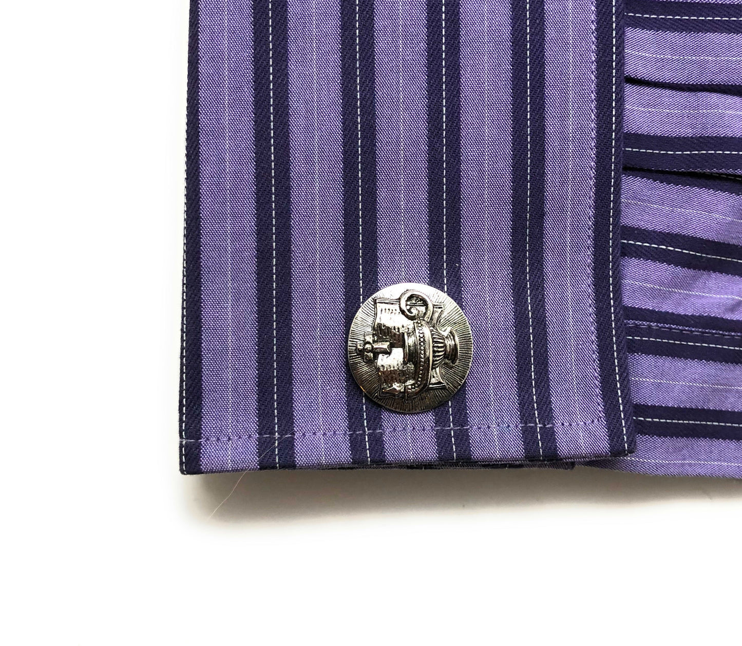 Close-up of a purple and navy striped shirt Ten Virgins oil lamp cufflinks Christian jewelry for men