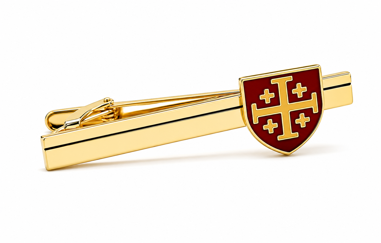 A gold tie bar featuring a shield-shaped red enamel emblem with a gold cross pattern, shown on a clean white background.