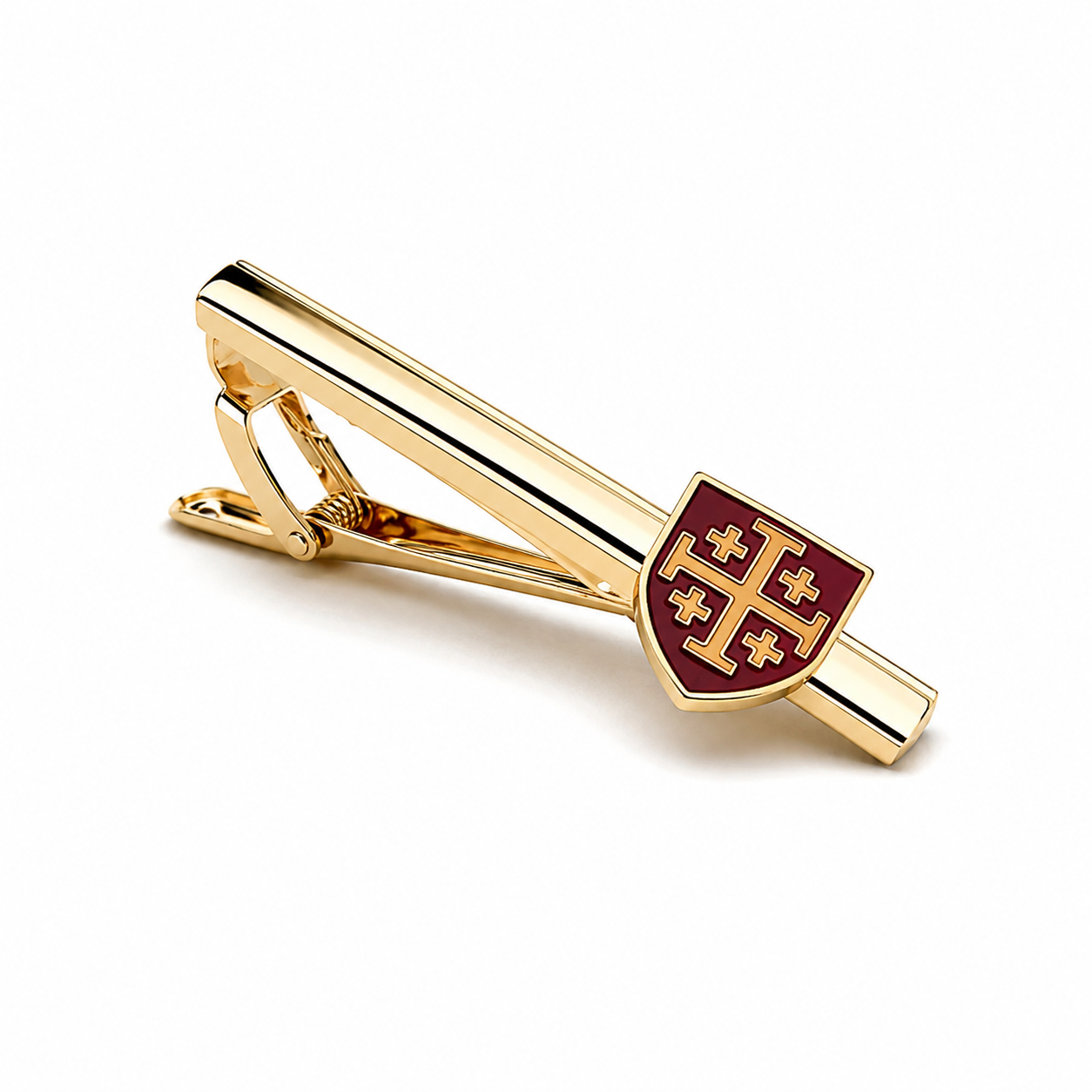 A gold tie bar featuring a shield emblem with a red background and gold cross motif, shown on a clean white background.