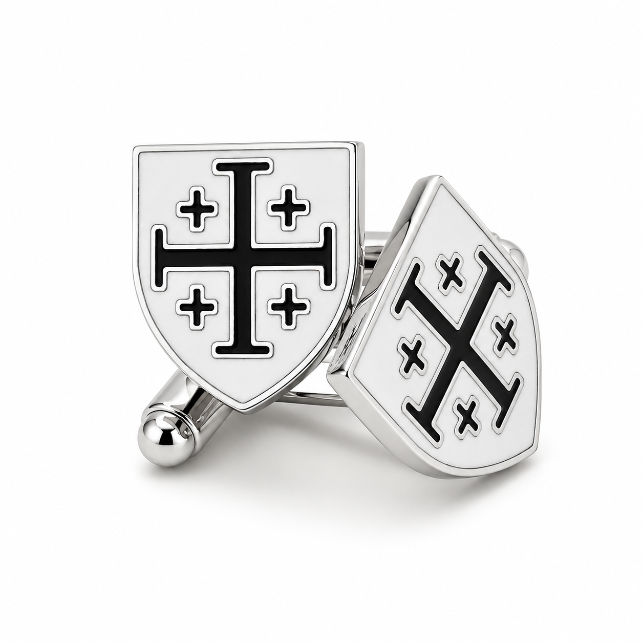 A pair of silver-toned shield-shaped cufflinks featuring a black Templar cross design on a white enamel background, shown on a clean white studio background.