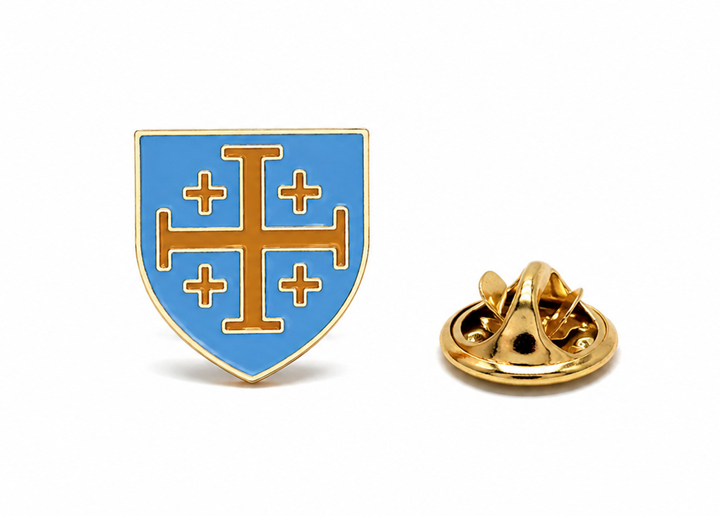 A small shield-shaped enamel pin with a gold border, light blue background, and gold cross motif, shown alongside its gold metal clutch backing on a white background.