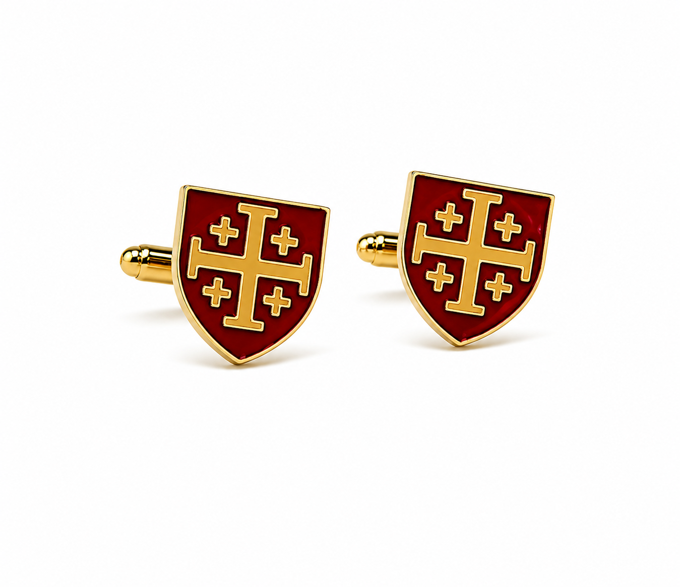 A pair of gold and red enamel shield-shaped cufflinks featuring a gold cross design on a white background.