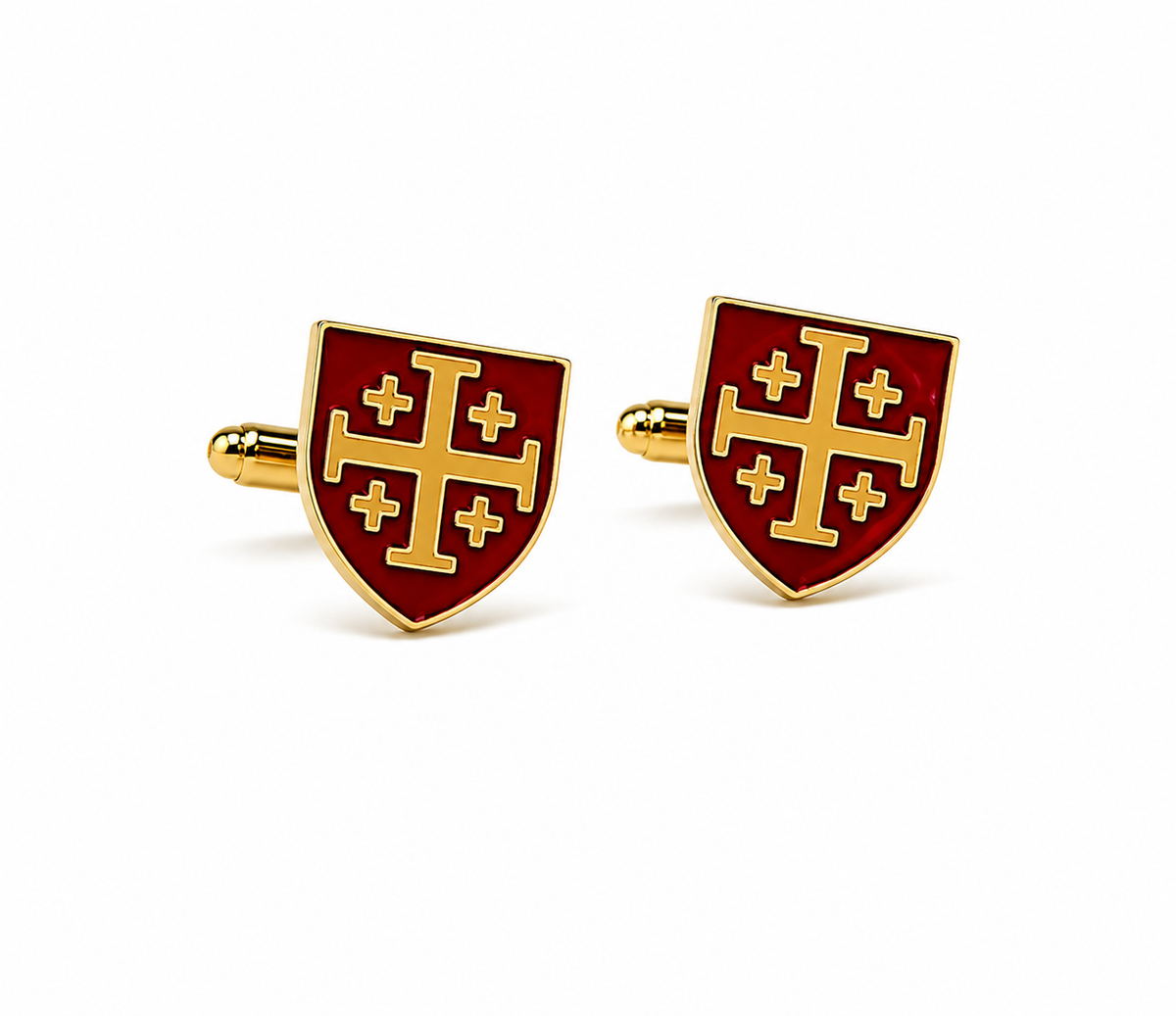A pair of gold and red enamel shield-shaped cufflinks featuring a gold cross design on a white background.