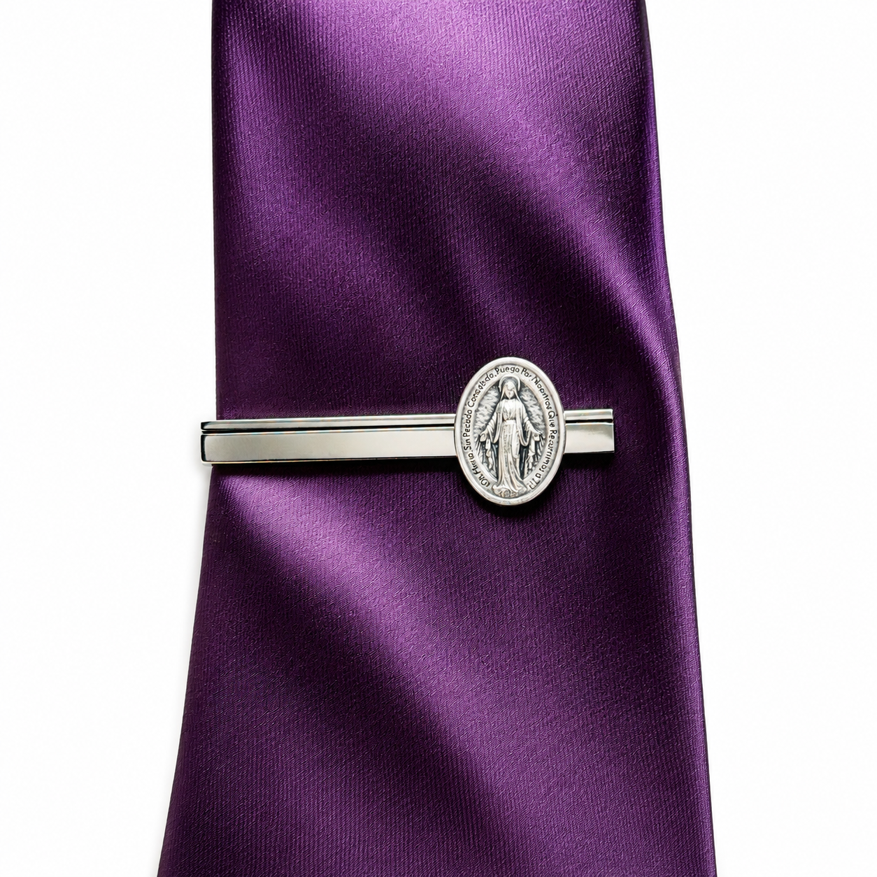 Silver tie clip on a purple satin tie against a white background Spanish Mother of Mary tie Clip