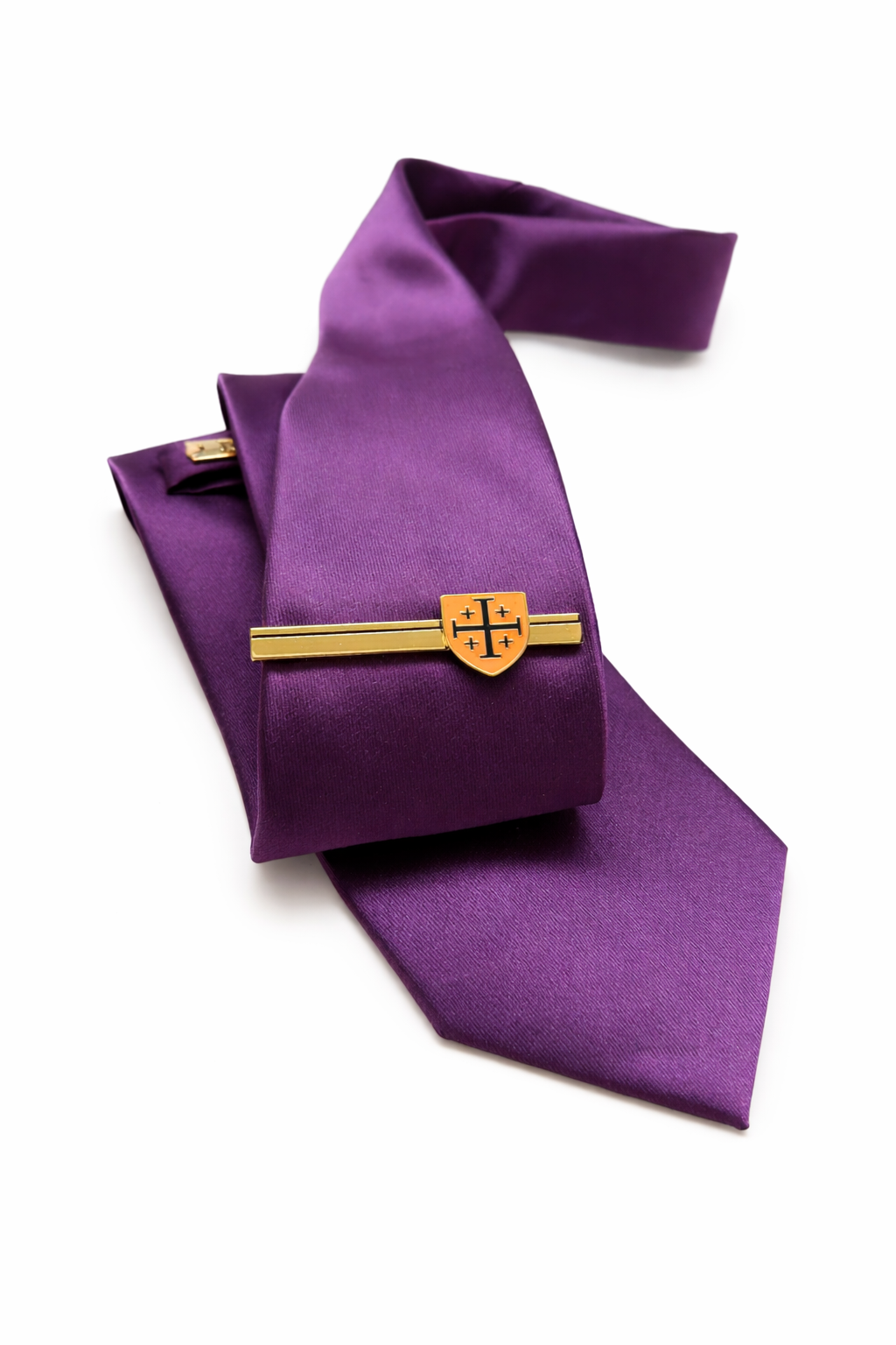 Purple tie with a gold clasp on a white background