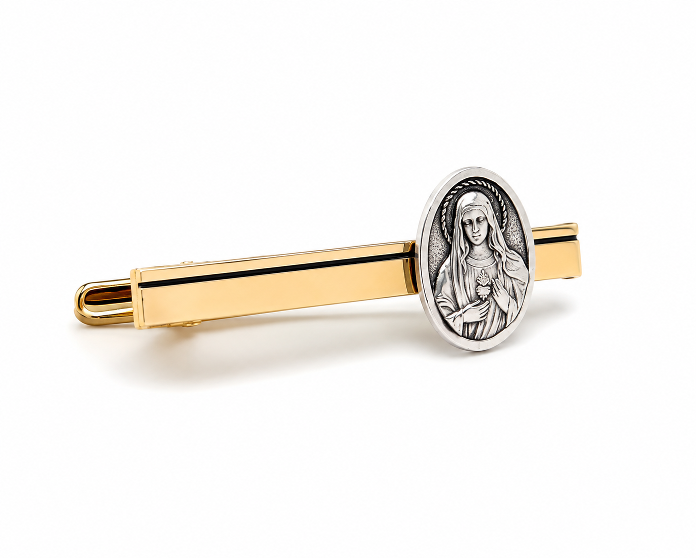 A gold-tone tie bar featuring an oval silver-tone medallion of the Virgin Mary holding a child, displayed on a clean white background.