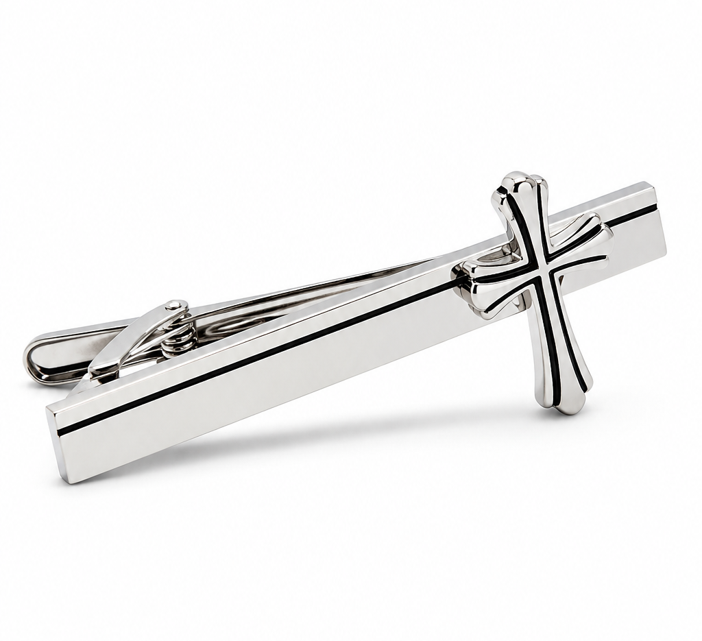 Silver cross tie clip on a white background