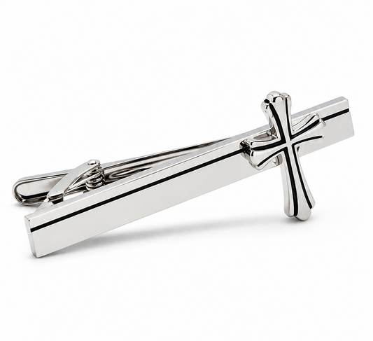 Silver cross tie clip on a white background