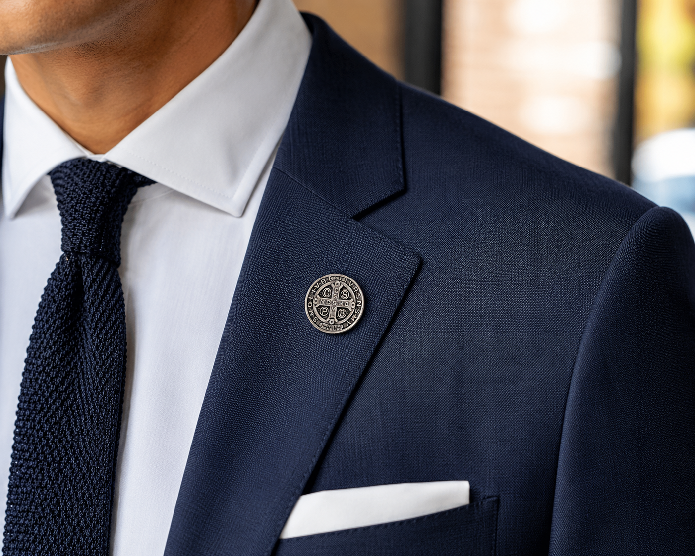 Navy suit jacket with a decorative pin on a blurred background Saint Benedict Medal Lapel Pin Silver Catholic Christian Religious Pin for Men