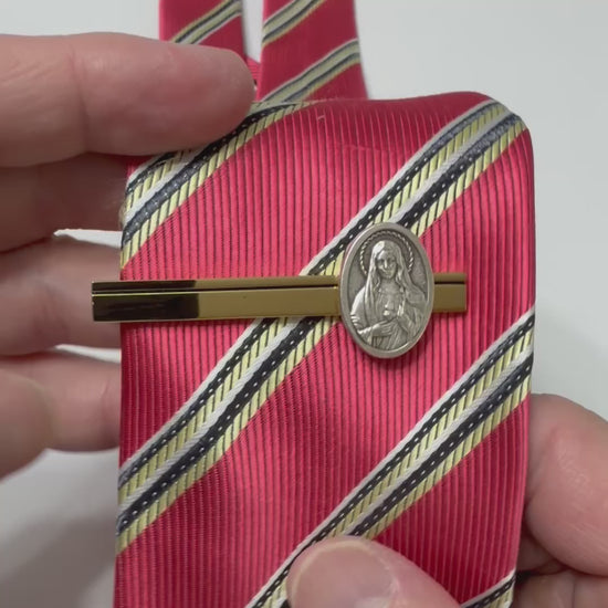 Sacred Heart of Mary Heritage Tie Clip featuring a polished gold tie bar with an antique silver Catholic medal for men.