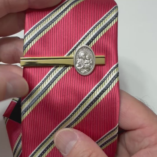 Saint Joseph Guardian Tie Clip handcrafted in the USA featuring a polished gold tie bar with a detailed silver Saint Joseph medal for Catholic men.